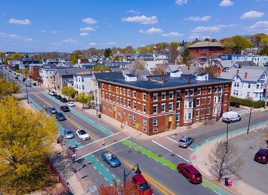 North Grafton, MA - Aerial View of a Busy Main Street with Homes and Commercial Buildings in Downtown North Grafton Massachusetts on a Sunny Day